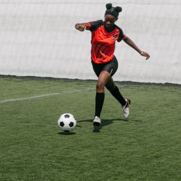 woman playing soccer