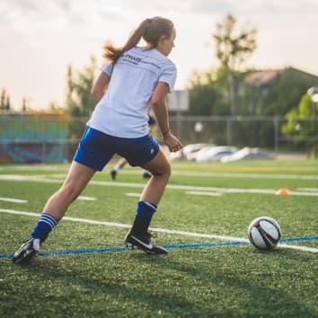 woman playing soccer