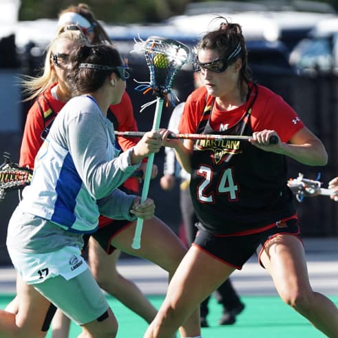 women playing lacrosse